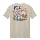 Bee Kind or Buzz Off bee graphic printed on a sand-colored super soft ring spun cotton t-shirt by Back Porch Apparel.