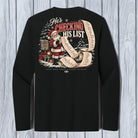 A black long-sleeve t-shirt with a large Christmas graphic on the back, featuring Santa Claus and the text 'He's CHECKING HIS LIST' on a light gray wood plank background.