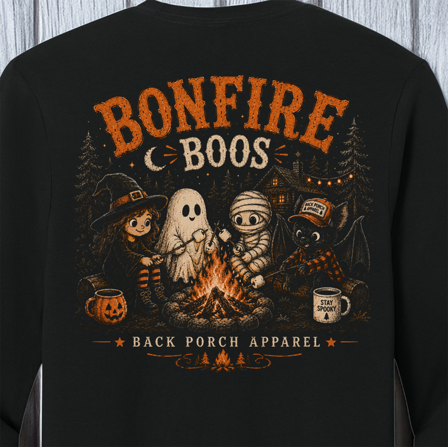 Bonfire Boos Halloween graphic with witch ghost mummy and bat around a campfire