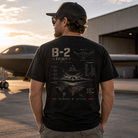 Man wearing a B-2 Stealth Bomber Back Porch Apparel Comfort Colors Shirt