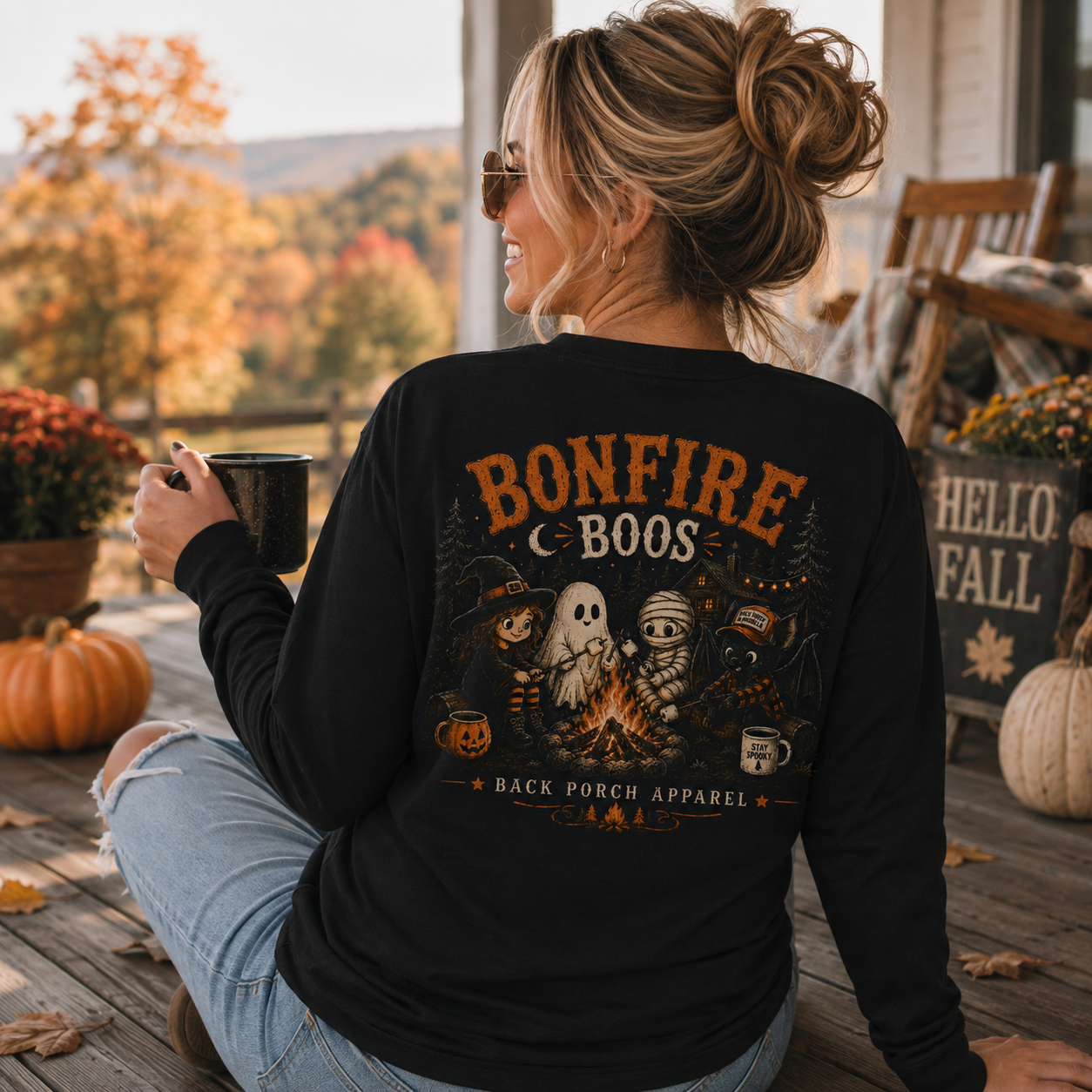 Woman wearing a Bonfire Boos Back Porch Apparel shirt