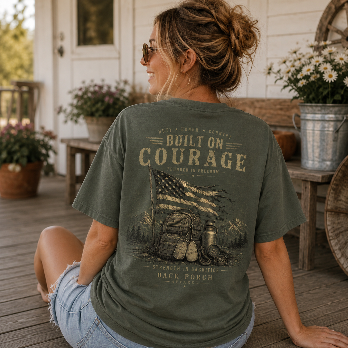 Woman wearing a Built On Courage Back Porch Apparel Shirt