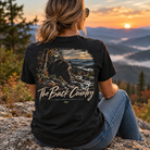 Woman wearing a Back Porch Apparel Black Bear The Back County Comfort colors shirt