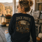 Woman wearing a Fall Back Porch Apparel Shirt
