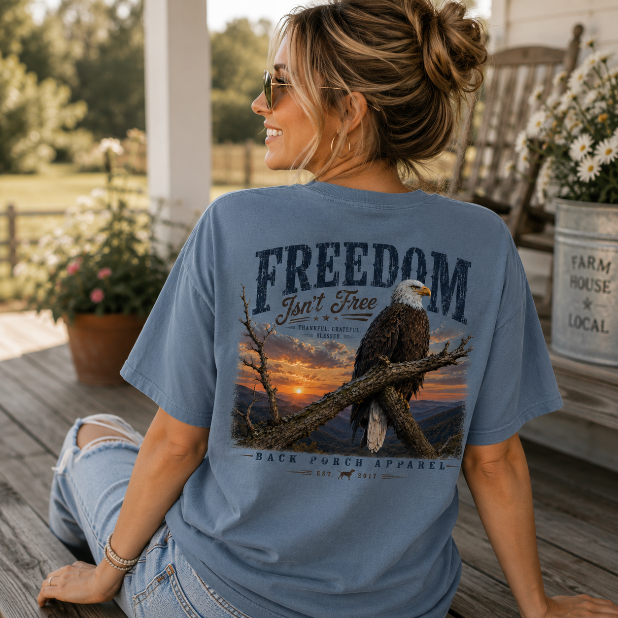 Woman wearing a Freedom Isn't Free Back Porch Apparel Shirt
