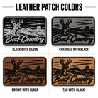 A four-quadrant graphic titled 'LEATHER PATCH COLORS' showing four rectangular Buck Country leather patches with different base colors: black with silver, charcoal with black, brown with black, and tan with black. Each patch features a deer silhouette and the text 'Buck Country Back Porch Apparel'.