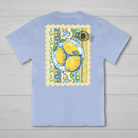Simply Southern mineral washed faded blue t-shirt featuring a lemon stamp graphic on the back