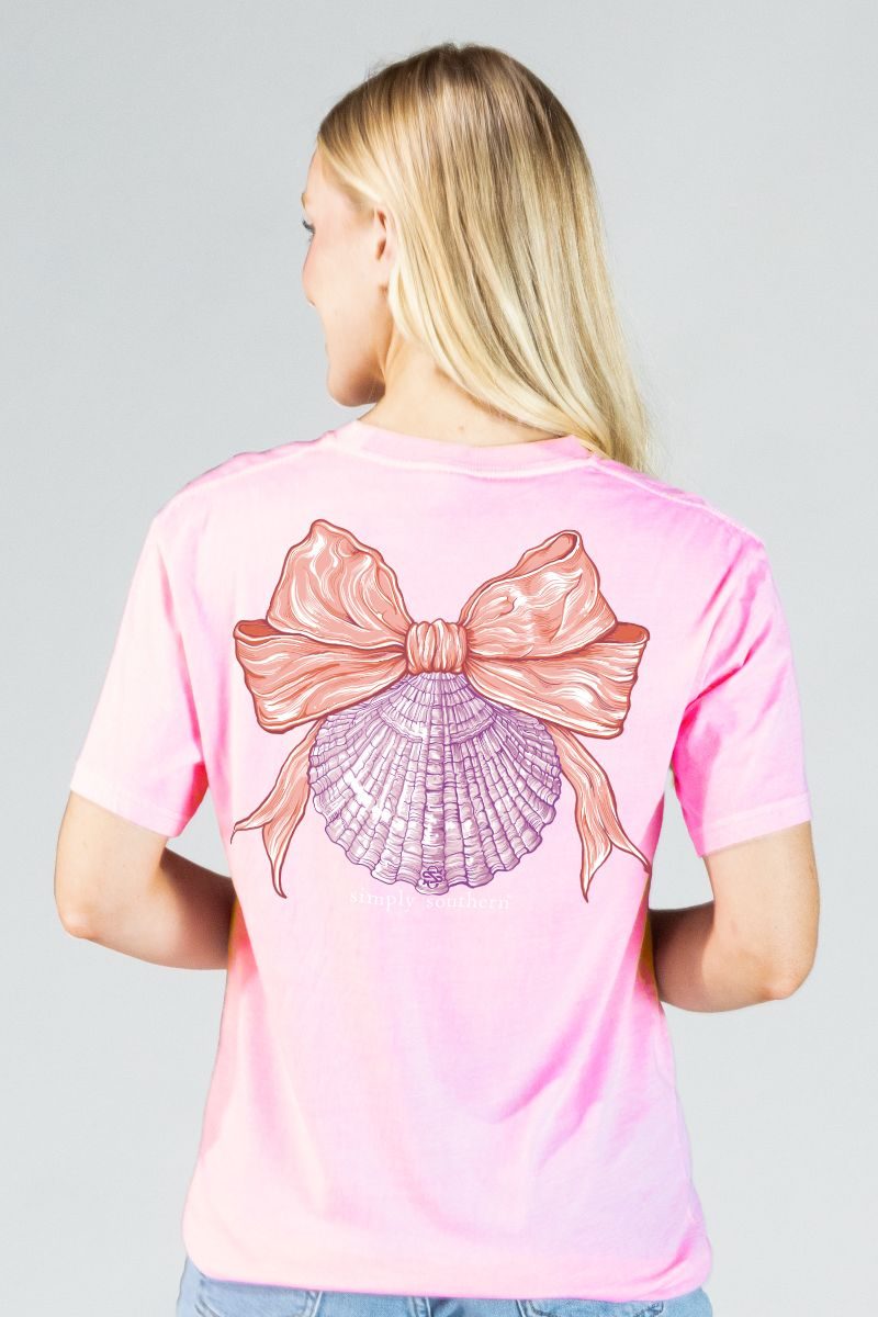 Model wearing Simply Southern pink mineral wash shell bow t-shirt