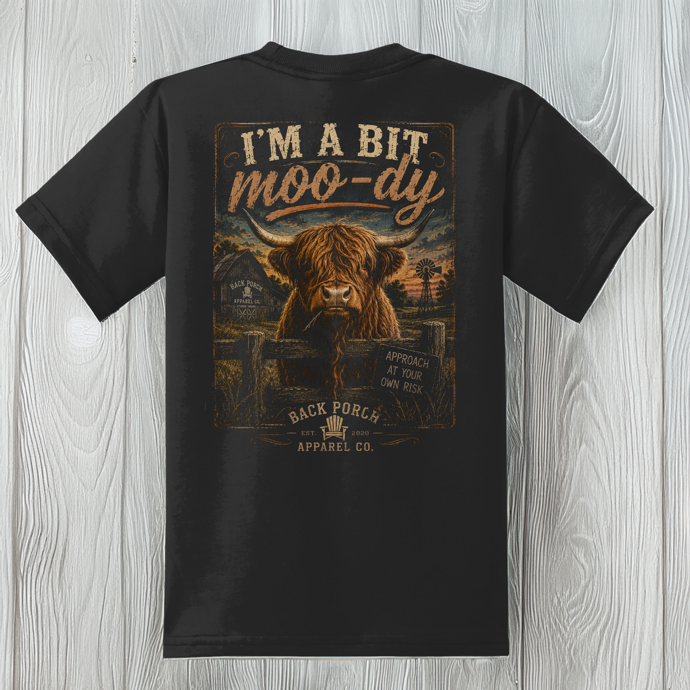 Youth Moody Highland Cow t-shirt on a black 50/50 blend tee featuring a vintage Highland cow graphic.