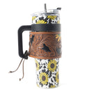 Myra Wide Wyoming 40oz Stainless Steel Tumbler Black and White Cow with Sunflowers and Hand Tooled Leather