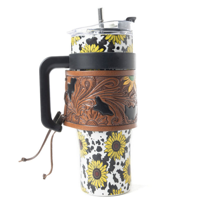 Myra Wide Wyoming 40oz Stainless Steel Tumbler Black and White Cow with Sunflowers and Hand Tooled Leather