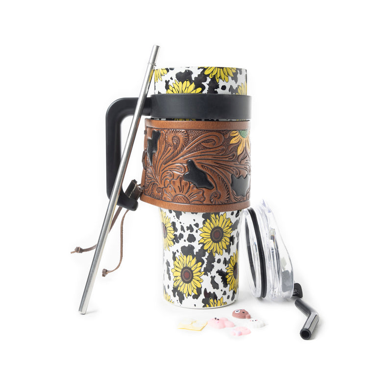 Myra Wide Wyoming 40oz Stainless Steel Tumbler Black and White Cow with Sunflowers and Hand Tooled Leather
