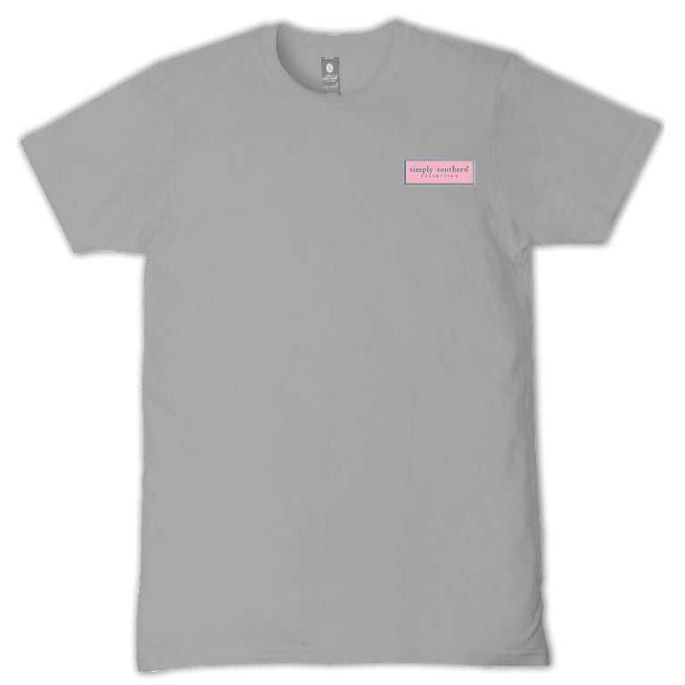 Simply Southern “His Mercies Are New Every Morning” short sleeve T-shirt featuring a colorful coastal sunrise with palm trees and ocean waves on a gray background