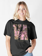 Simply Southern black cotton tee worn by model featuring Virginia state graphic with pink camo and bow design