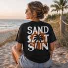 Woman wearing a Sand Salt Sun Back Porch Apparel Shirt