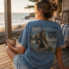 Woman wearing the Sand Surf Shark Teeth Bigfoot Back Porch Apparel Comfort Colors Shirt