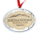Shenandoah National Park wooden souvenir ornament with layered snowflake construction, engraved natural wood centerpiece, and red ribbon isolated on a white background.