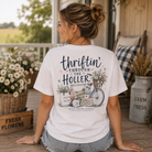 Woman wearing a Thriftin Through The Holler Back Porch Apparel Shirt