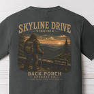 Skyline Drive Bigfoot graphic t-shirt on Comfort Colors garment-dyed tee featuring Sasquatch overlooking the Blue Ridge Mountains