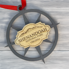 Shenandoah National Park compass rose wood ornament displayed on a rustic wood background with engraved mountain artwork and red hanging ribbon.