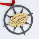 Layered Shenandoah National Park compass rose ornament with engraved mountain design isolated on a white background and red ribbon.
