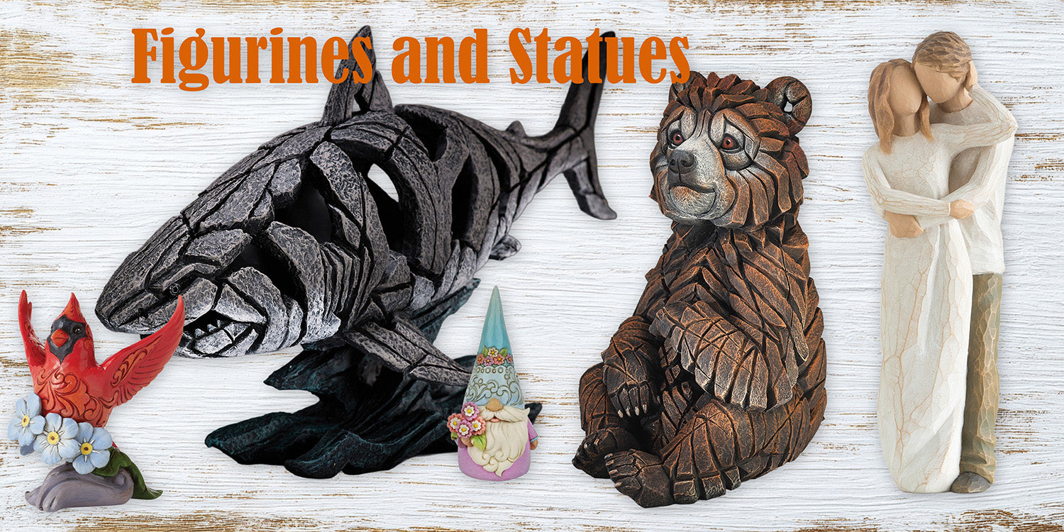 Collection of decorative figurines and sculptural collectibles displayed together, showcasing detailed craftsmanship and artistic design