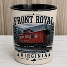 Front Royal Virginia ceramic shot glass featuring a vintage illustration of the historic Front Royal Train Company caboose against the Blue Ridge Mountains with distressed patriotic typography and black interior.