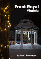 Snow-covered gazebo decorated with holiday lights in Front Royal, Virginia at night, photographed by Scott Turnmeyer