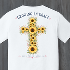 Sunflower cross artwork with Growing In Grace message and floral details on a Christian-themed graphic t-shirt