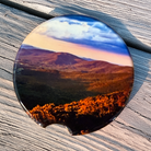 Ceramic car coaster featuring a sunset view from Hogback Overlook along Skyline Drive in Shenandoah National Park with rolling Blue Ridge Mountain scenery.