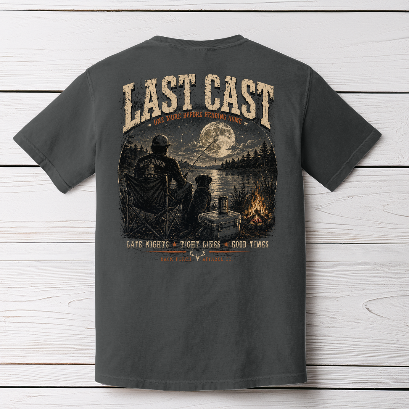 Fishing artwork featuring an angler and dog by a campfire beside a moonlit lake with Last Cast slogan