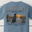 Marsh Life Simple Life graphic t-shirt on Comfort Colors garment-dyed tee featuring a black Labrador sitting on a dock overlooking a coastal marsh at sunset