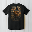 Funny Highland cow artwork with I'm A Bit Moo-dy slogan and Approach At Your Own Risk sign on a rustic farm scene