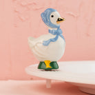 Nora Fleming Porch Pal goose mini wearing blue bonnet on Nora Fleming platter