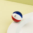 Nora Fleming Beach, Please! Mini featuring a colorful hand-painted beach ball displayed on a white serving piece