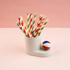 Nora Fleming Beach, Please! Mini styled with colorful party straws and summer décor for pool parties, beach days, and seasonal celebrations