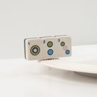 Front view of the Nora Fleming Mahj-ical Mini showcasing hand-painted Mahjong tile details
