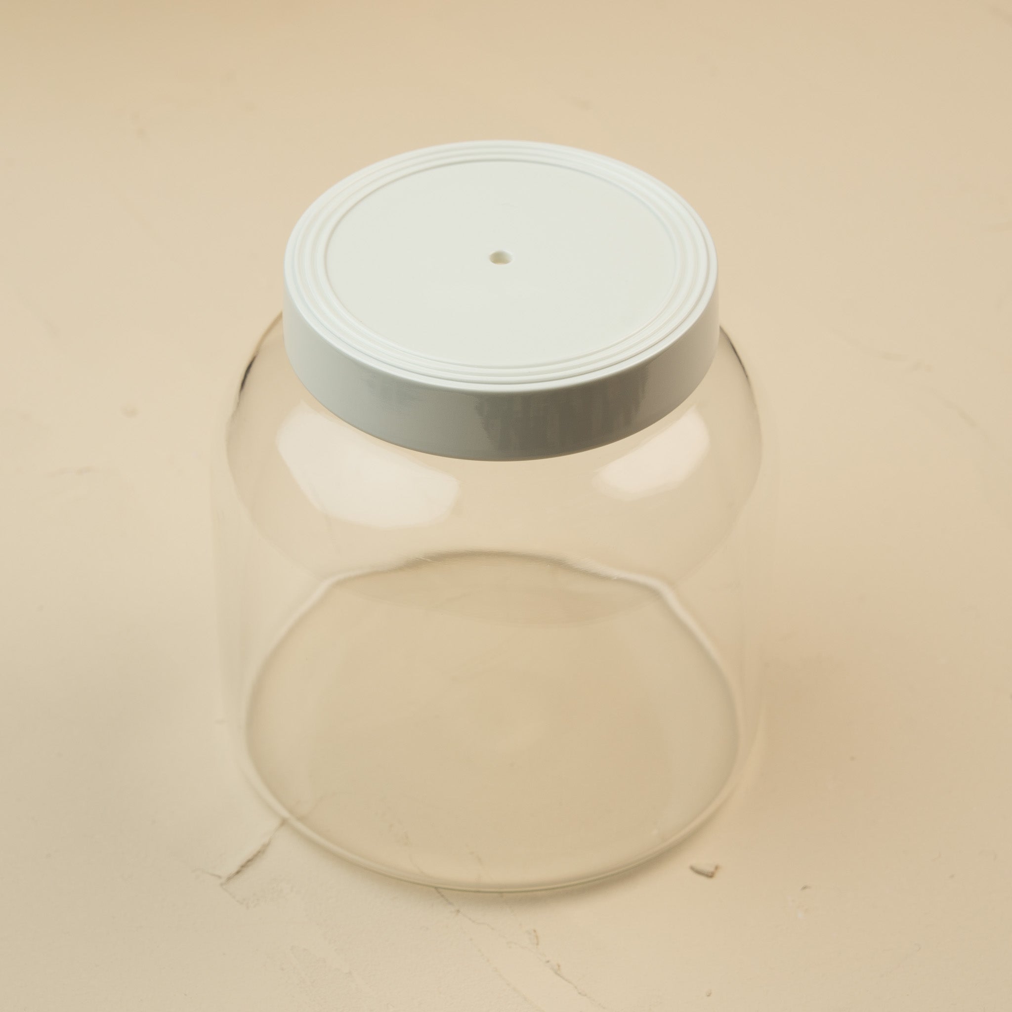 Nora Fleming Super Canister 6-inch clear storage canister with white lid and mini attachment opening