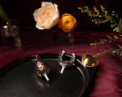 Nora Fleming Plato Ovalado Gift Set featuring black platter and three metallic minis in an elegant display