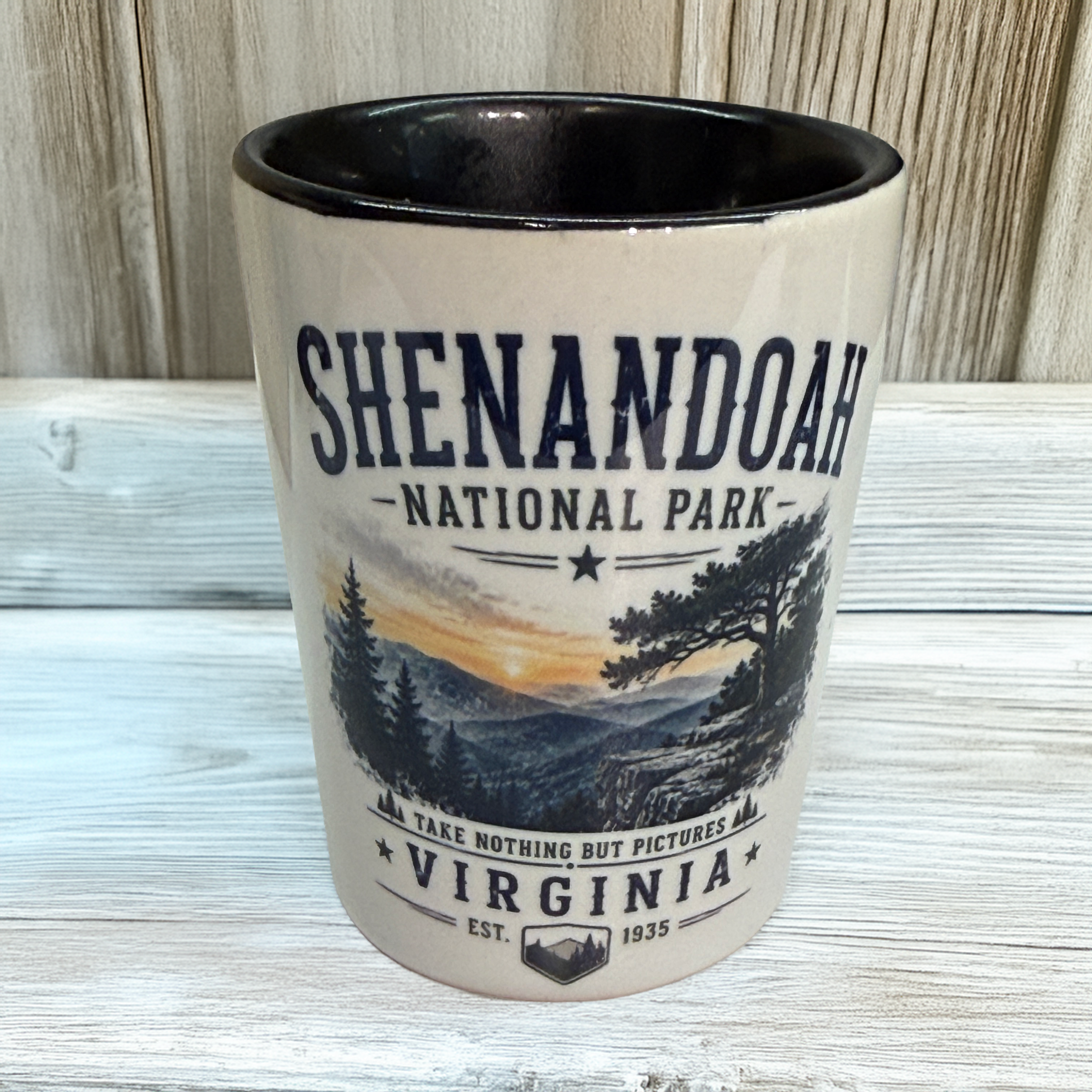 Ceramic Shenandoah National Park shot glass featuring a scenic Blue Ridge Mountain overlook landscape and Virginia souvenir design.