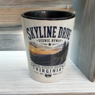 Skyline Drive Virginia ceramic shot glass featuring a winding mountain road, sunset landscape, and scenic byway souvenir design.