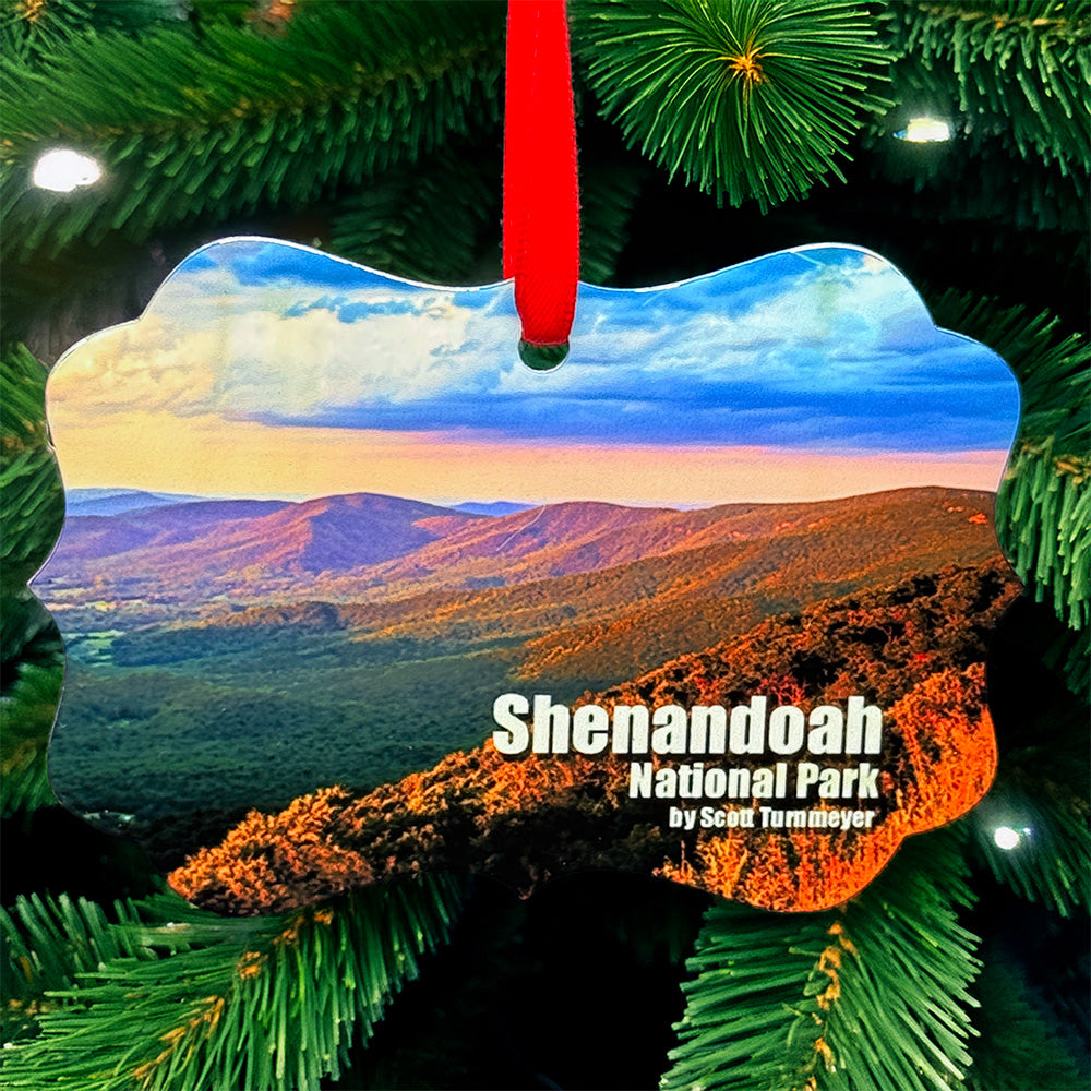 Shenandoah National Park metal ornament with red ribbon, featuring mountain landscape on front and park map with coordinates on back